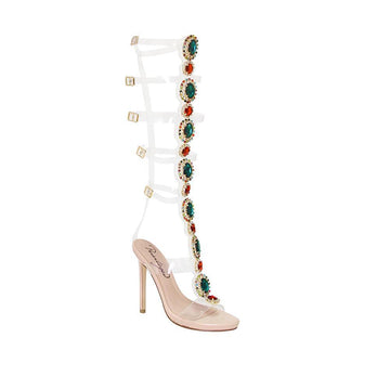 Nude colored heels with knee high jewel embellishment and belt strap closure