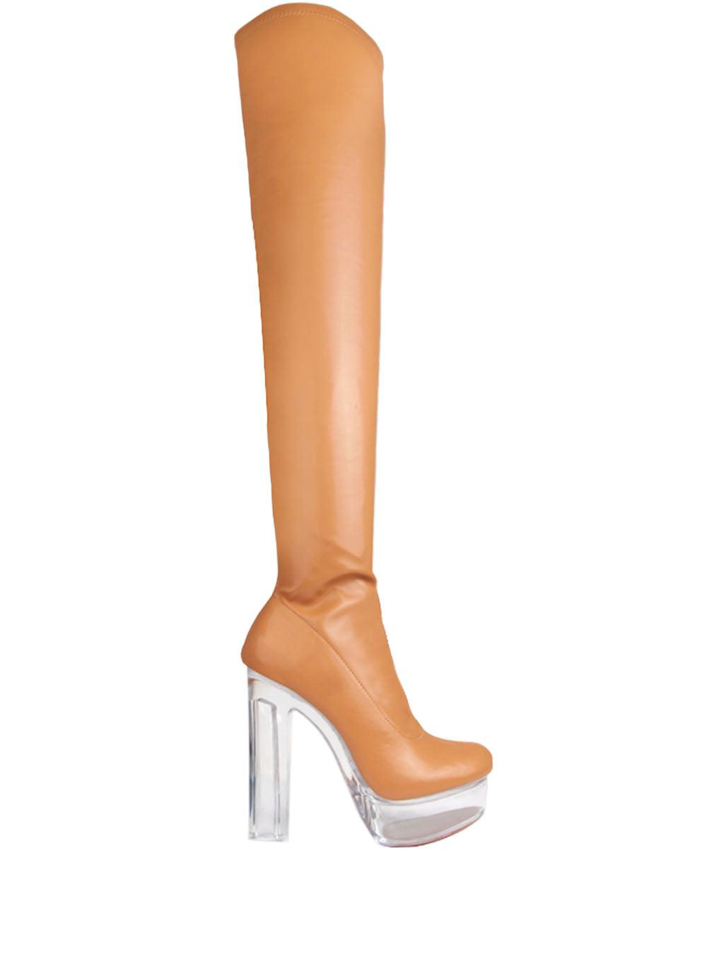 Translucent knee high platforms with block heels, tan leather upper, and slip-on design