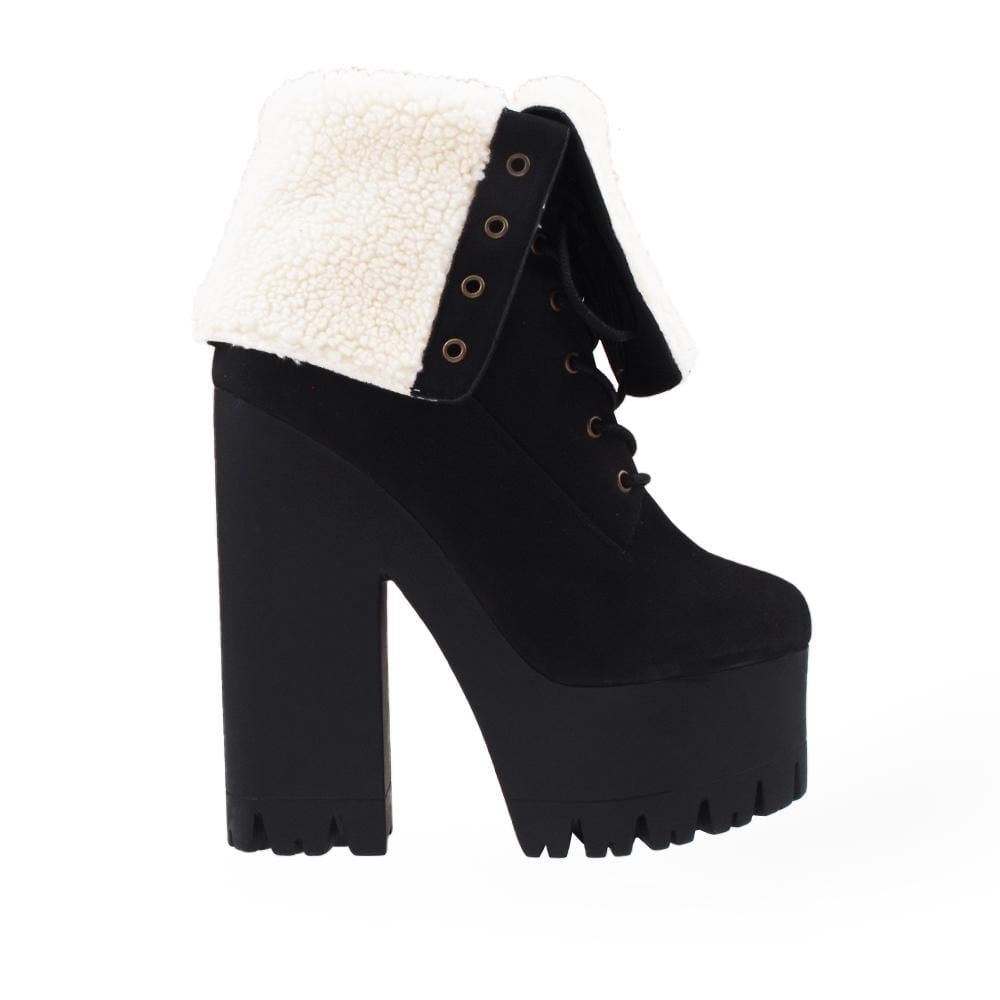 Black colored platform boot heels with white shearling cuff and lace up closure