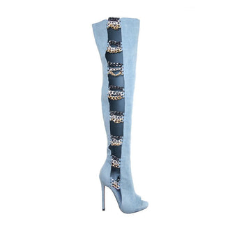 Over-the-knee boots  with stiletto heel, chain accent, and side zipper clasp in denim color 