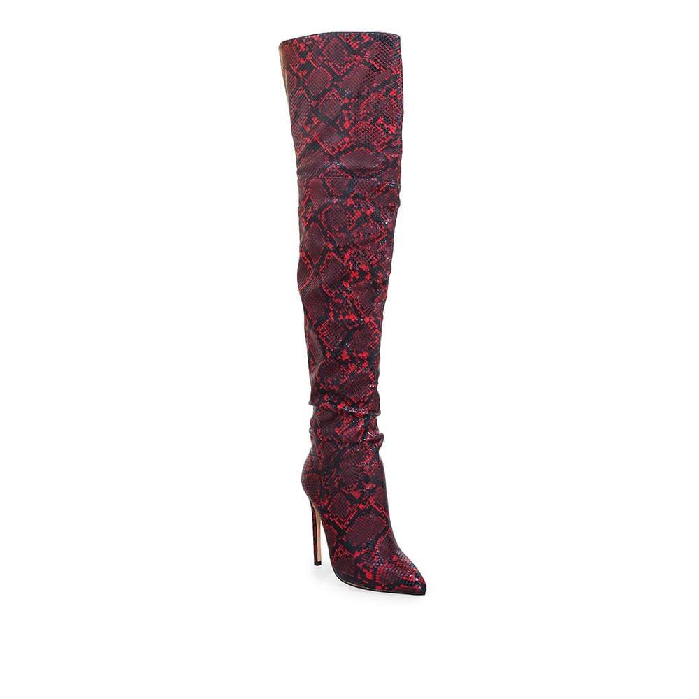 Red thigh high women's booties with faux snake skin-corner view