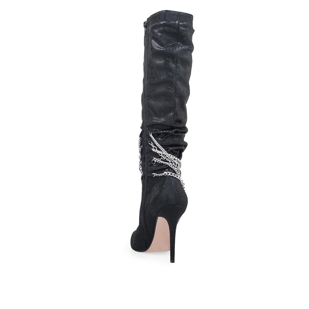 Black knee high women's boots with metallic silver chains-posterior view