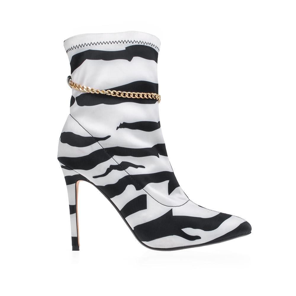 Ankle boots with zebra pattern and chain