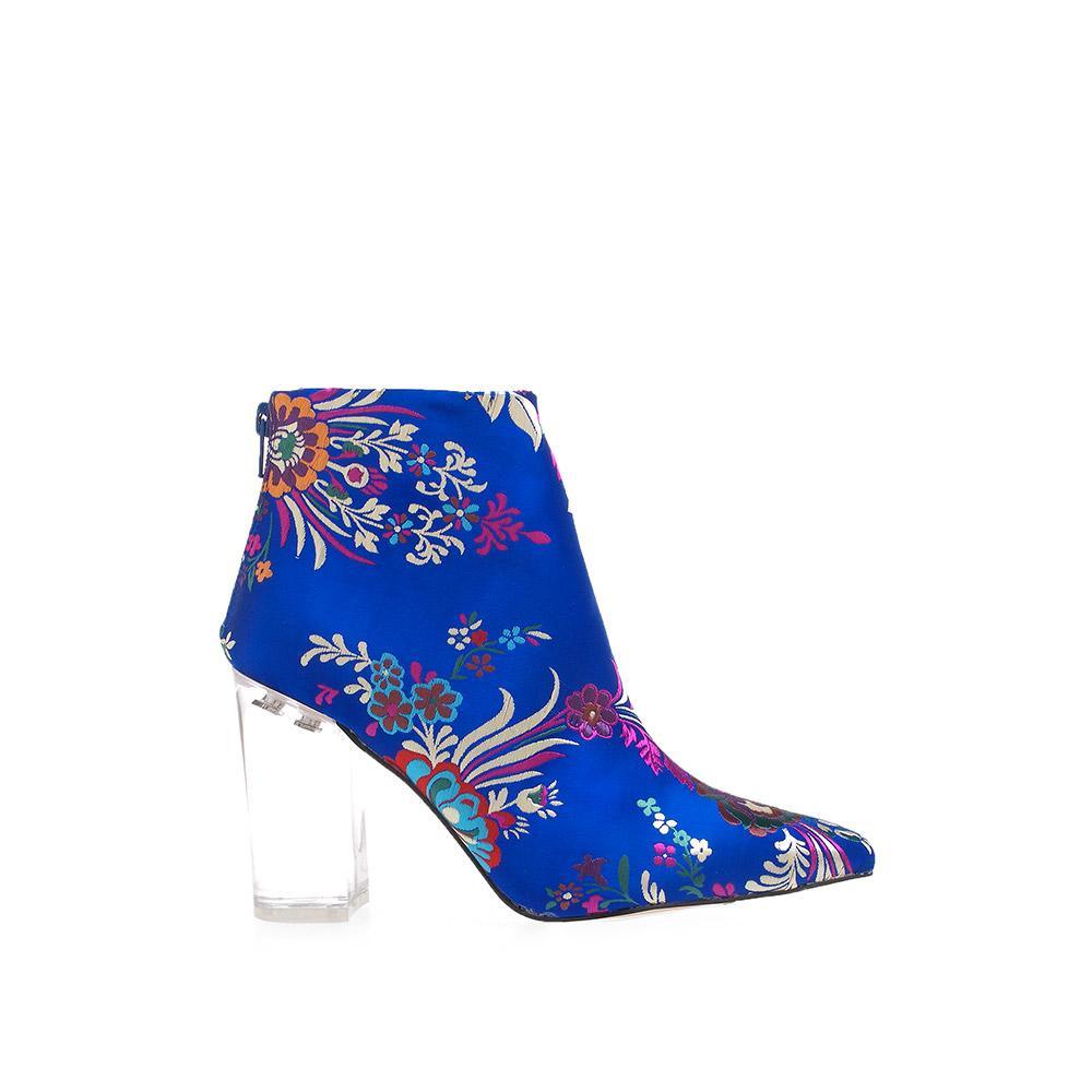 Women's ankle boots with transparent block heels and a colourful floral blue upper.