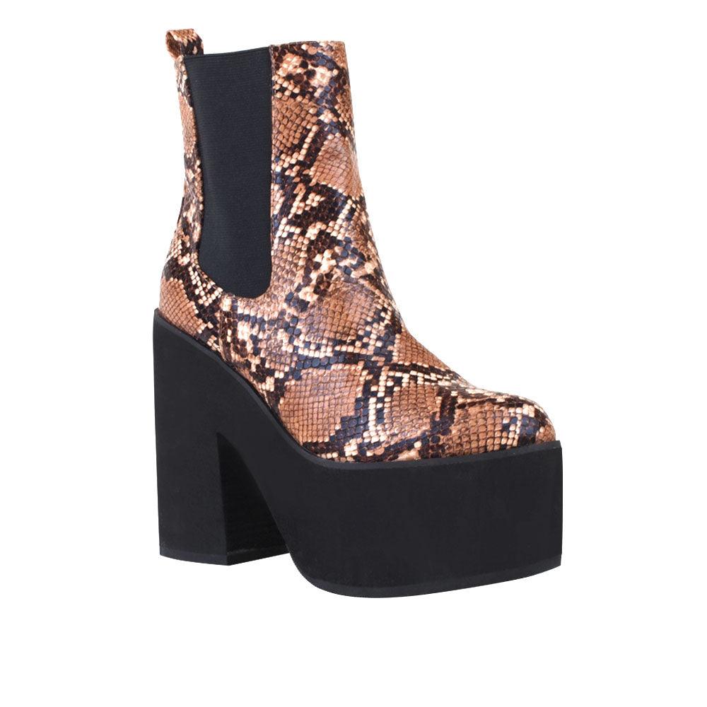 Women's black-colored ankle boots with block heels, upper tan snake pattern, and slip-on style-corner view