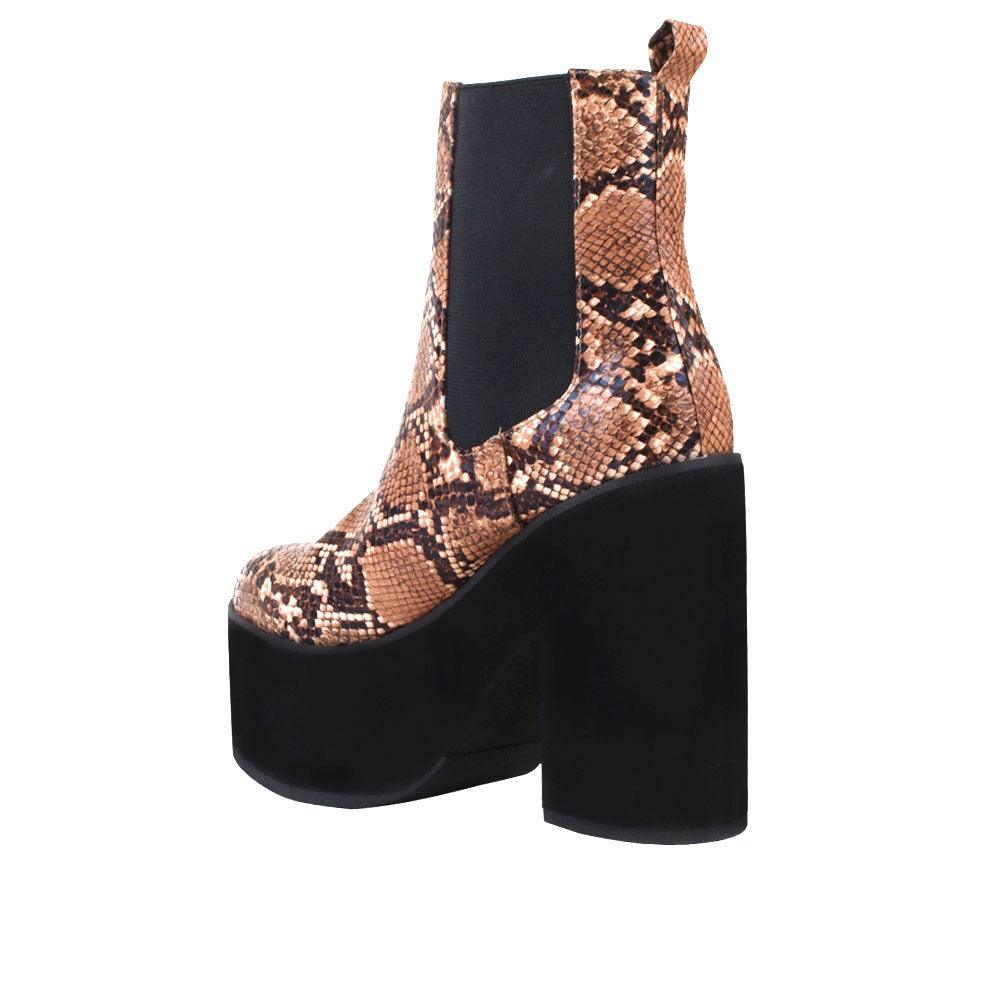 Women's black-colored ankle boots with block heels, upper tan snake pattern, and slip-on style-posterior view