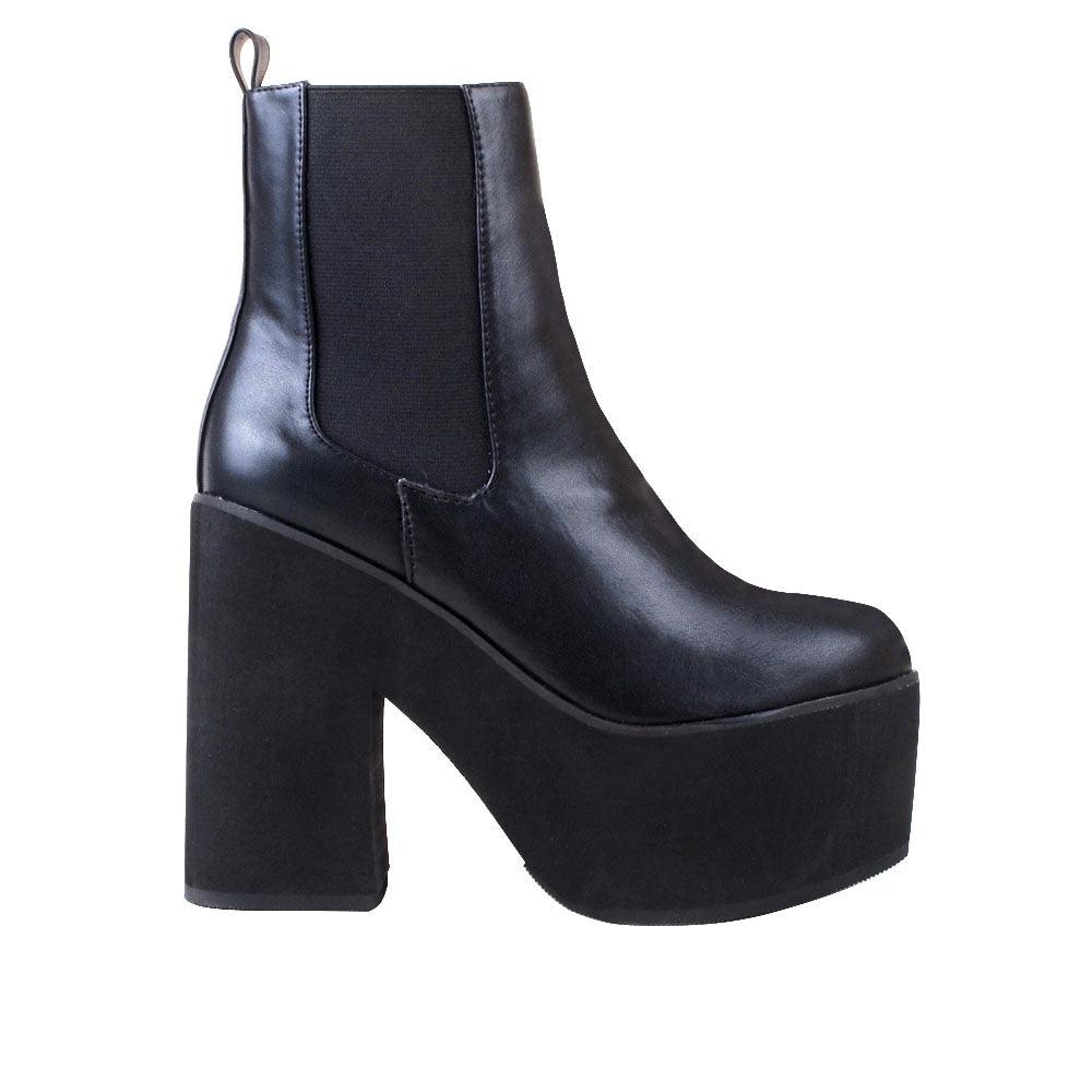 Women's black-colored ankle boot with block heels and slip-on style-side view