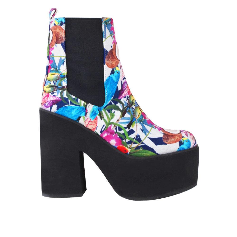 Women's black-colored block heel ankle boots with a floral-multicolored pattern on the upper and slip-on style-side view