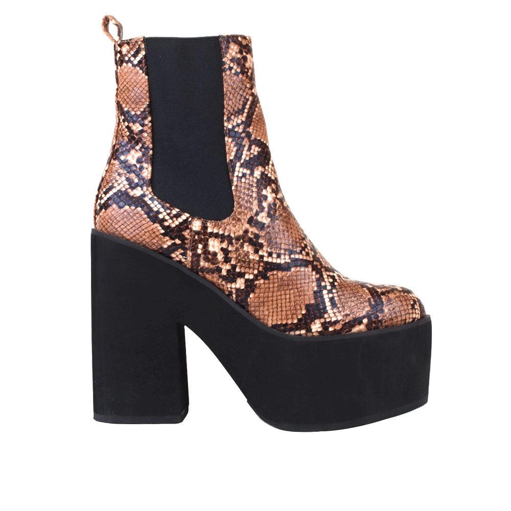 Women's black-colored ankle boots with block heels, upper tan snake pattern, and slip-on style-side view