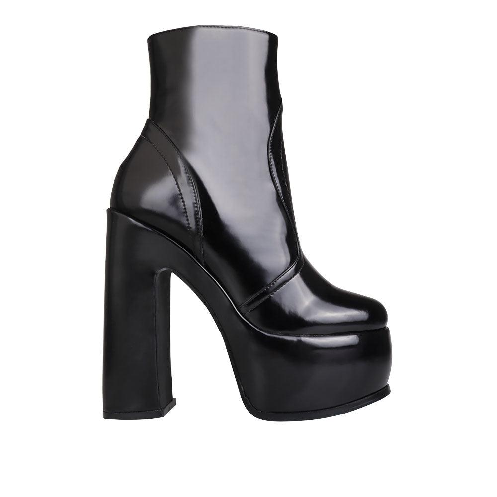 Women's black-colored ankle boots with block heels and side zipper closure-side view