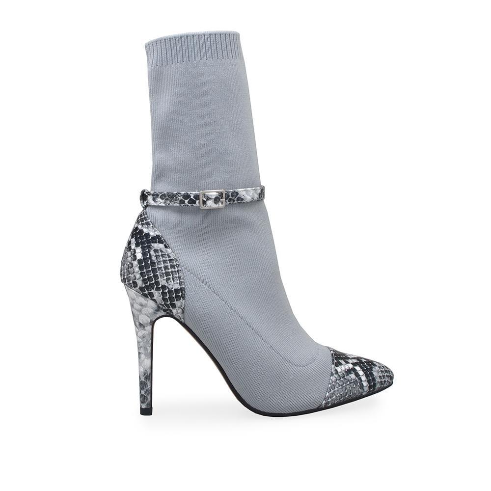 Ladies' pointed toe ankle boot in silver-color with snake design heel and ankle buckle closure.