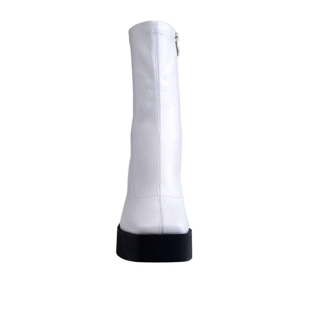 White colored women boots with black block heels-front view