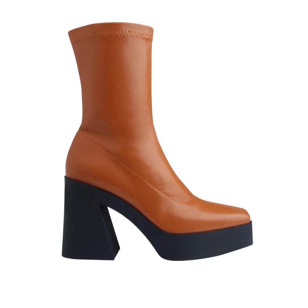 Brown colored women boots with black block heels-side view