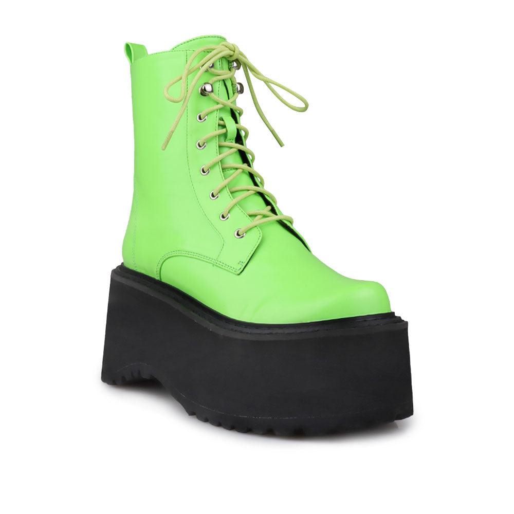 Green colored women platform boots with black base-corner view