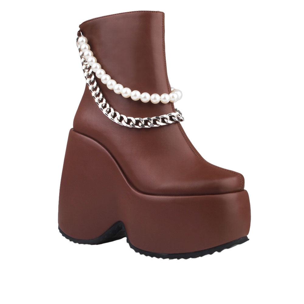 Dark brown colored women bootie platforms with pearl and silver embellished strap-corner view