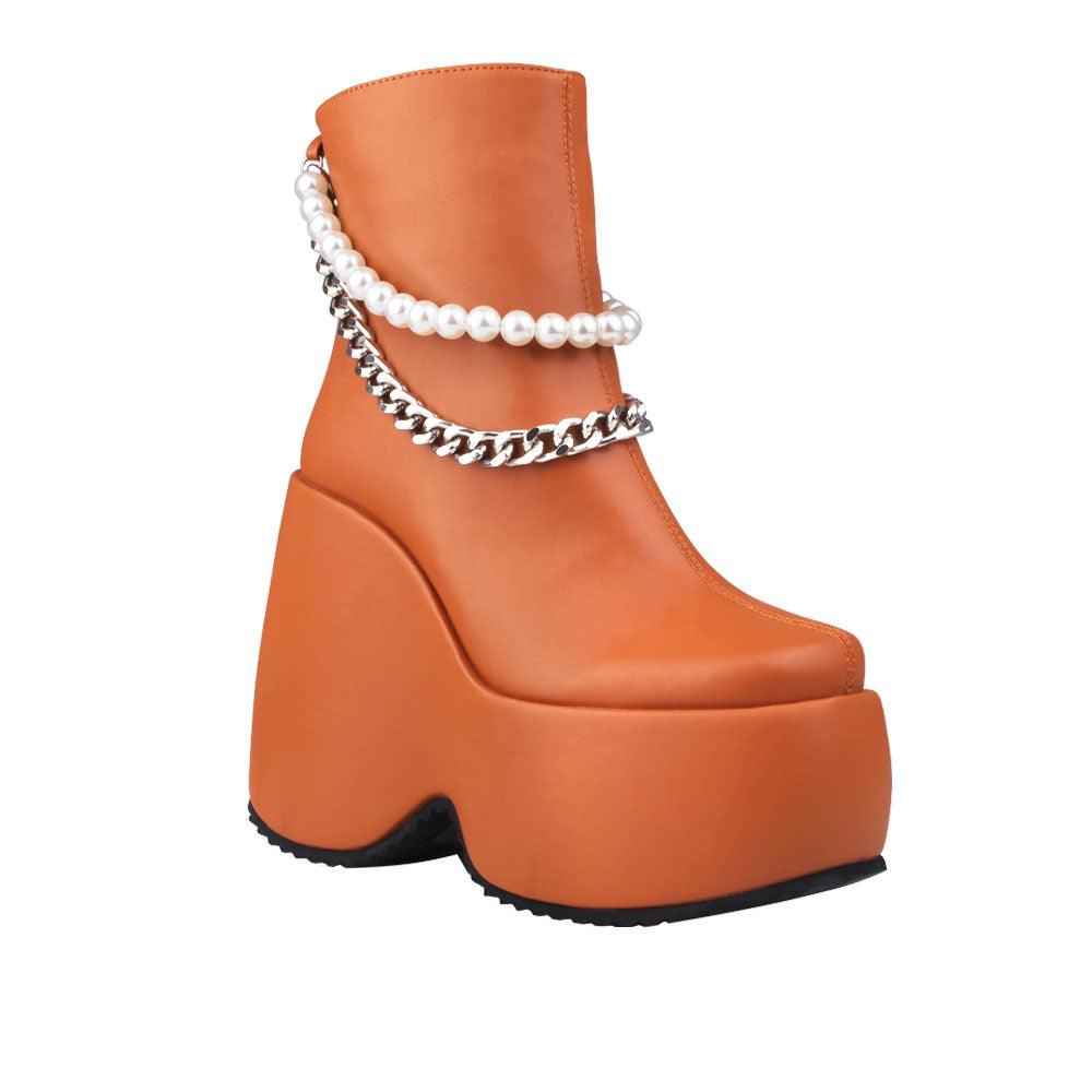 Brown colored women bootie platforms with pearl and silver embellished strap-corner view