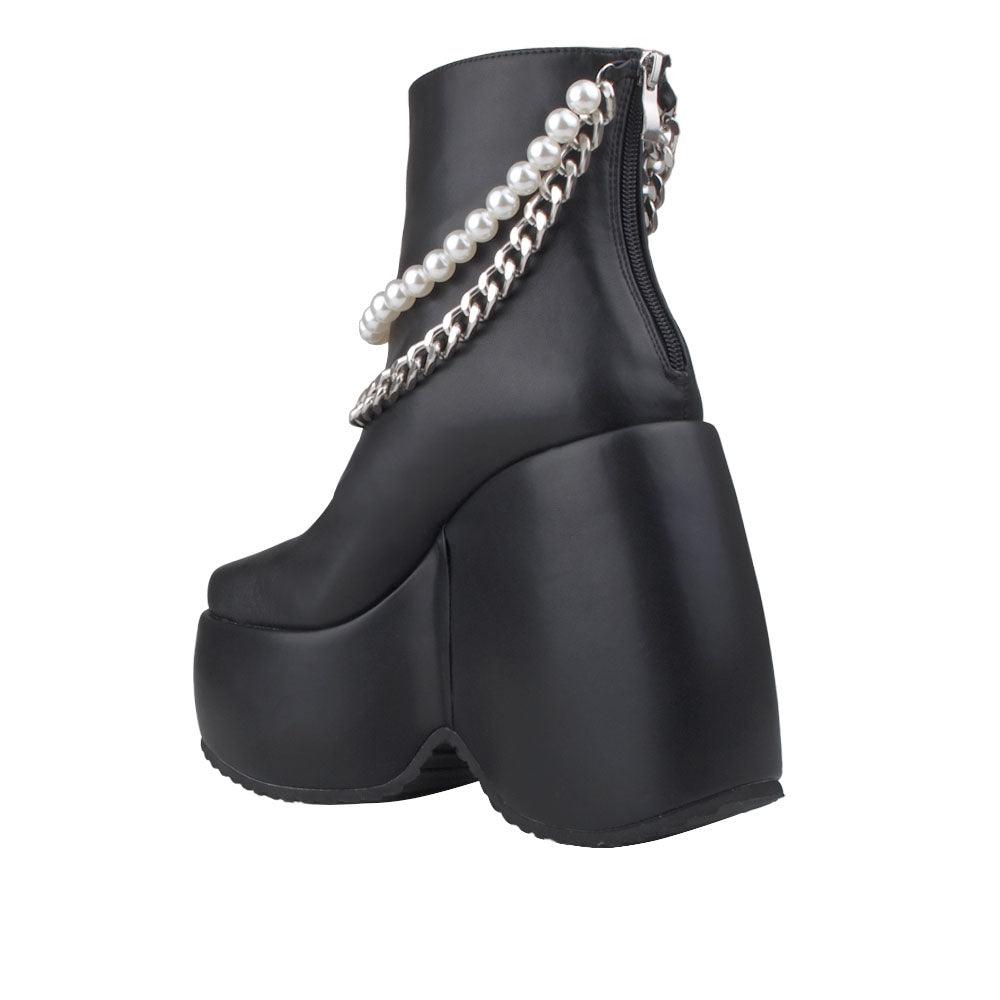 Black colored women bootie platforms with pearl and silver embellished strap-posterior view