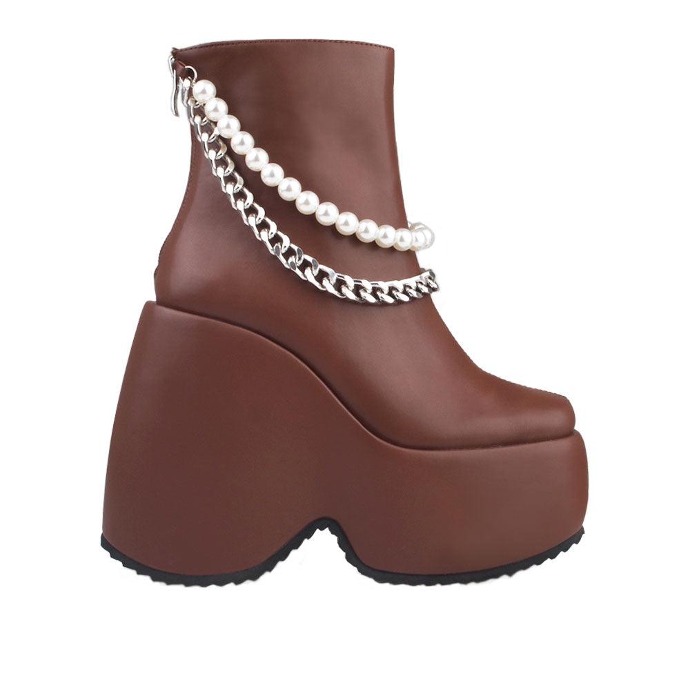 Dark brown colored women bootie platforms with pearl and silver embellished strap-side view