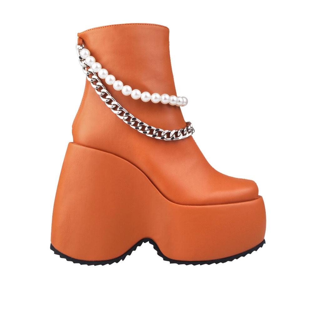 Brown colored women bootie platforms with pearl and silver embellished strap-side view