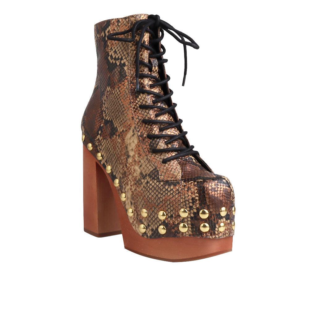 Brown and gold snake textured women boots with brown heel-corner view