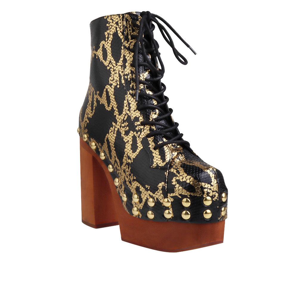 Black and gold snake textured women boots with brown heel-corner view