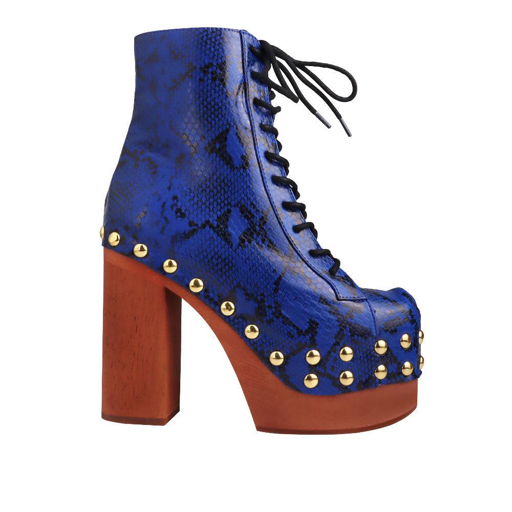 Blue and gold snake textured women boots with brown heel-side view