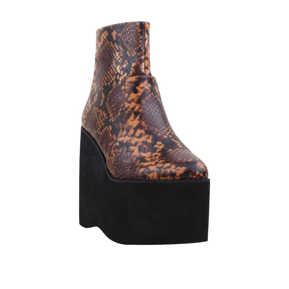 Tan snake textured women booties with black platform-corner view