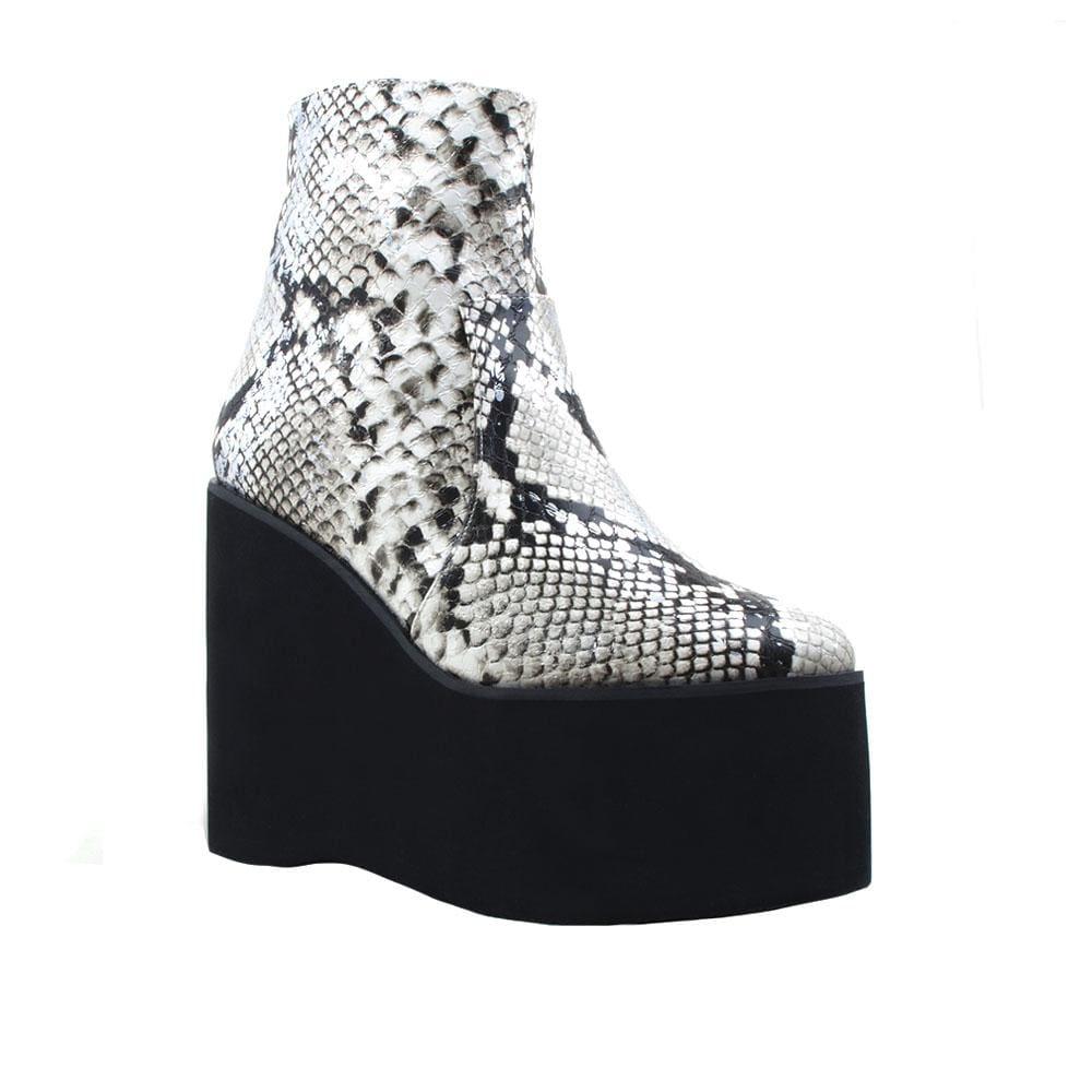 White snake textured women booties with black platform-corner view