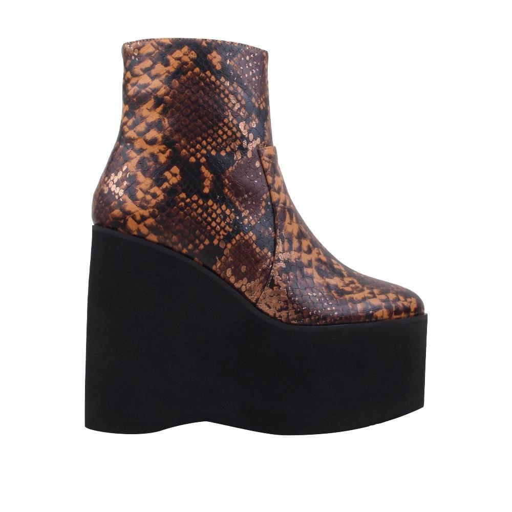 Tan snake textured women booties with black platform-side view