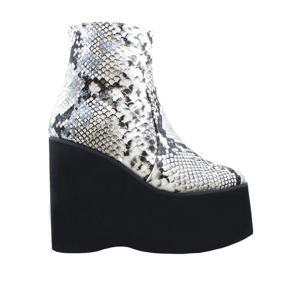 White snake textured women booties with black platform-side view