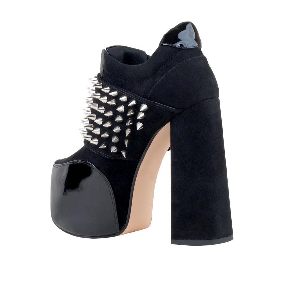 Women ankle bootie platform with studs and chunky heels in black-posterior view