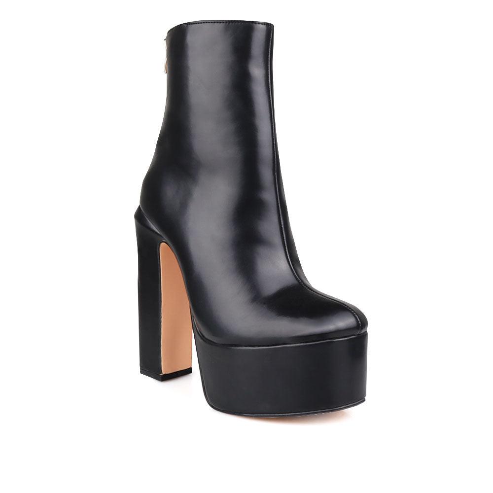 Vegan leather chunky heel women booties in black-corner view