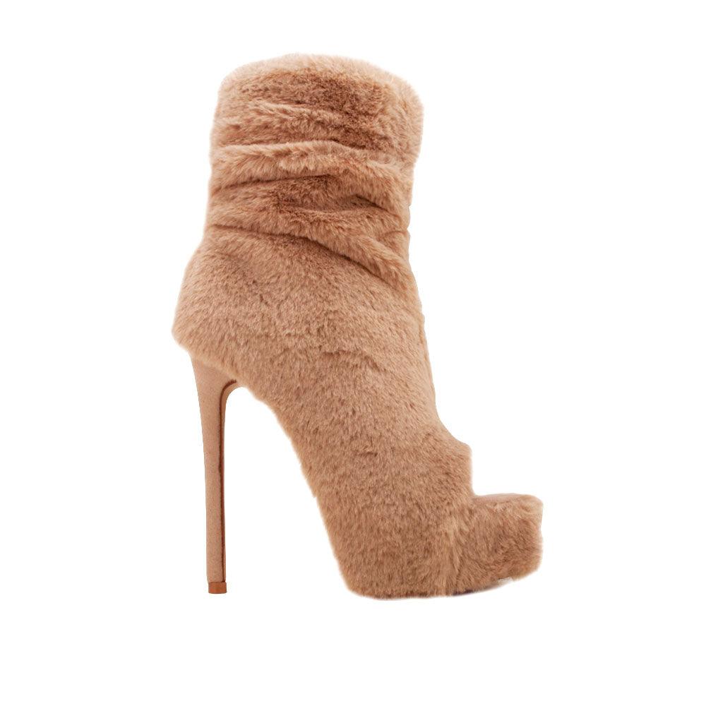 Shearling ankle boot heels in nude with an open toe and rear zipper closure.