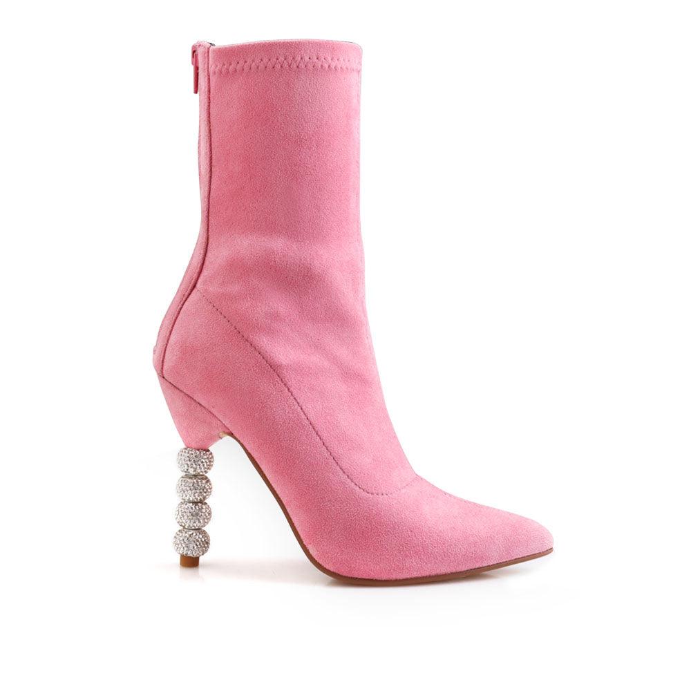 Pink colored ankle high boot with beaded heels and rear zip closure.