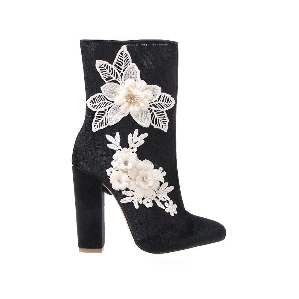 Black colored ankle high boot with block heels, white floral design and rear zipper closure