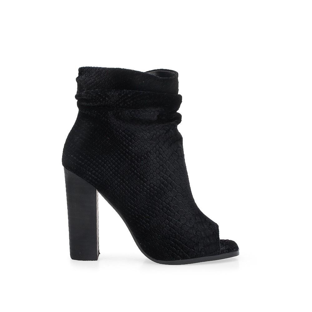 Black colored ankle boot with block heels and an open toe.