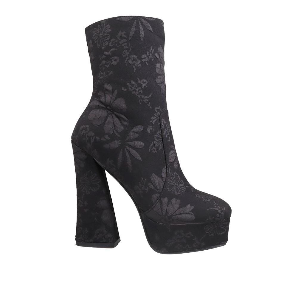 Platform ankle high boot heels with flowery design and side zipper closure in black.