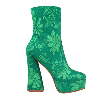 Green platform ankle boot heels with flowers design and side zip closure.