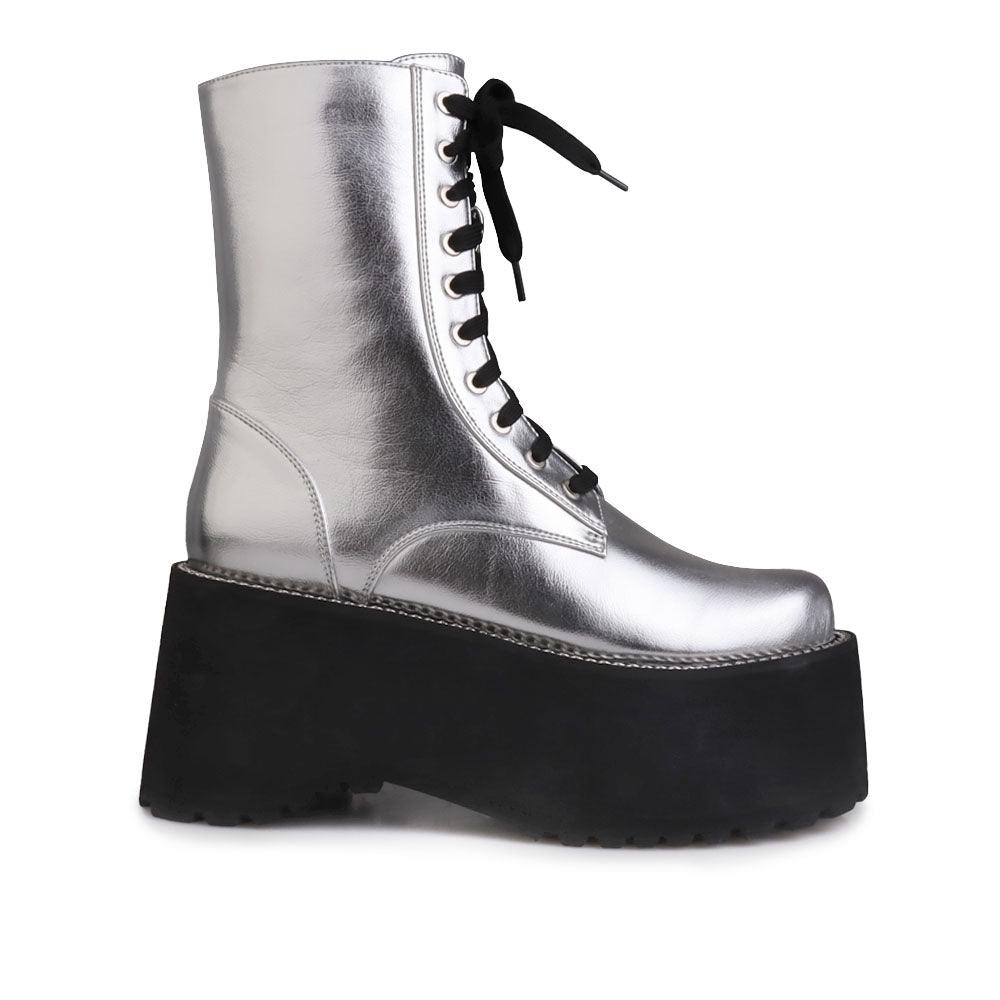 Black colored platform boots with silver upper, lace up design and side zipper clasp