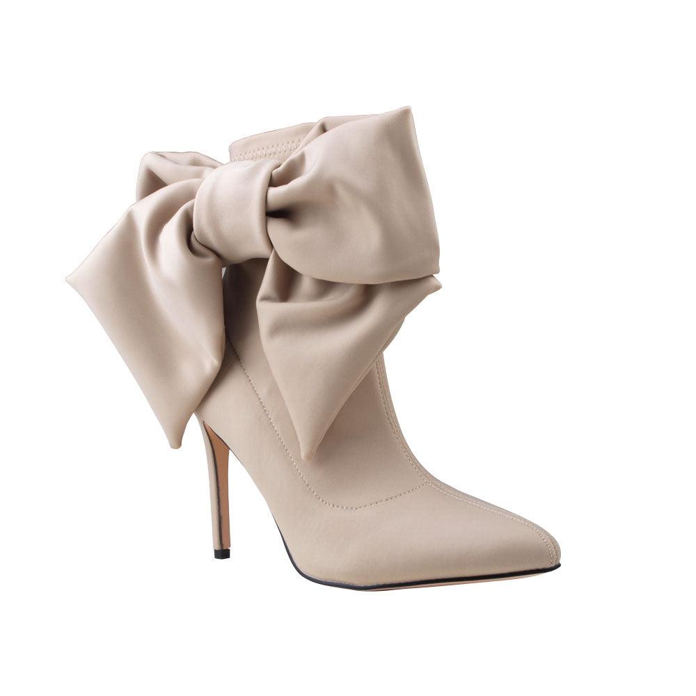 Nude lycra upper women's boot heels with bow-corner view