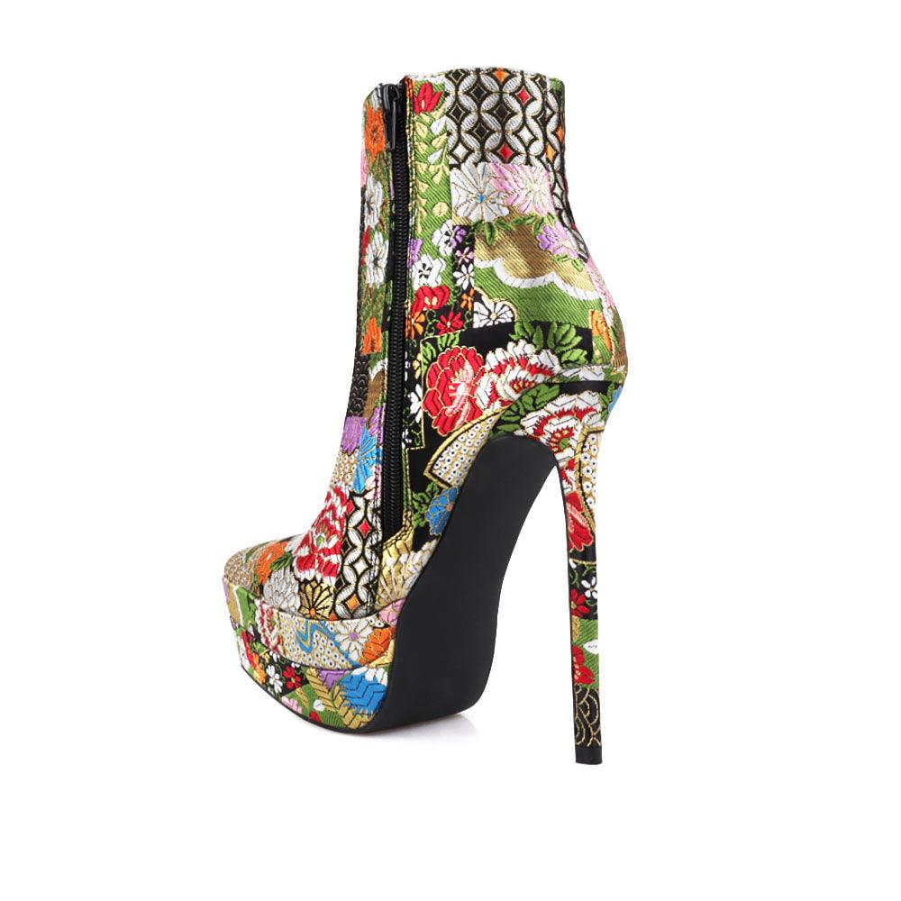 Stiletto women heel with black floral motive and vegan suede-posterior view