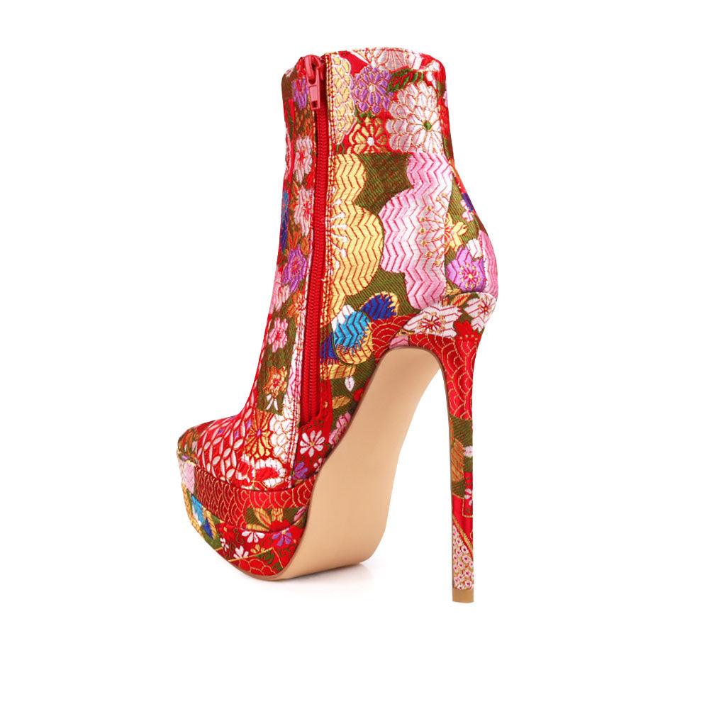 Stiletto women heel with floral motive and vegan suede in red-posterior view