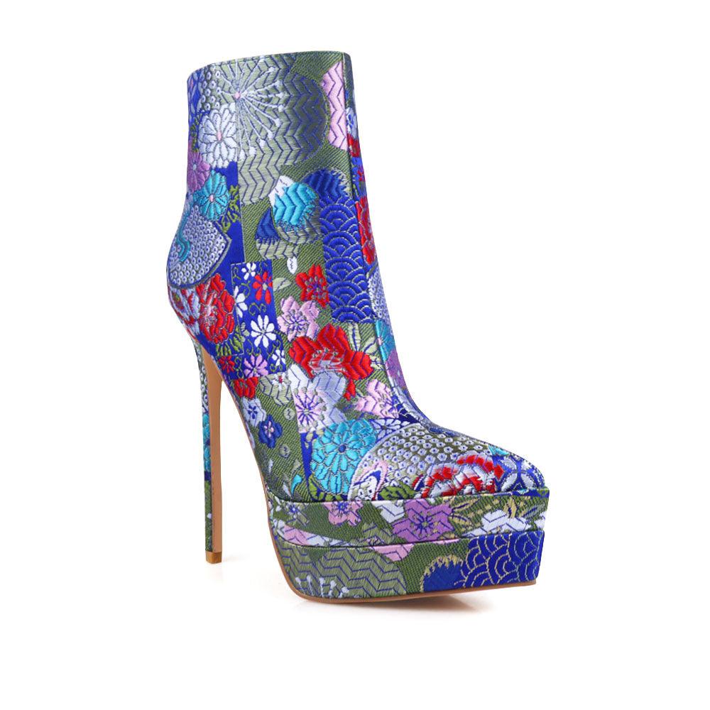 Stiletto women heel with turquoise floral motive and vegan suede-corner view