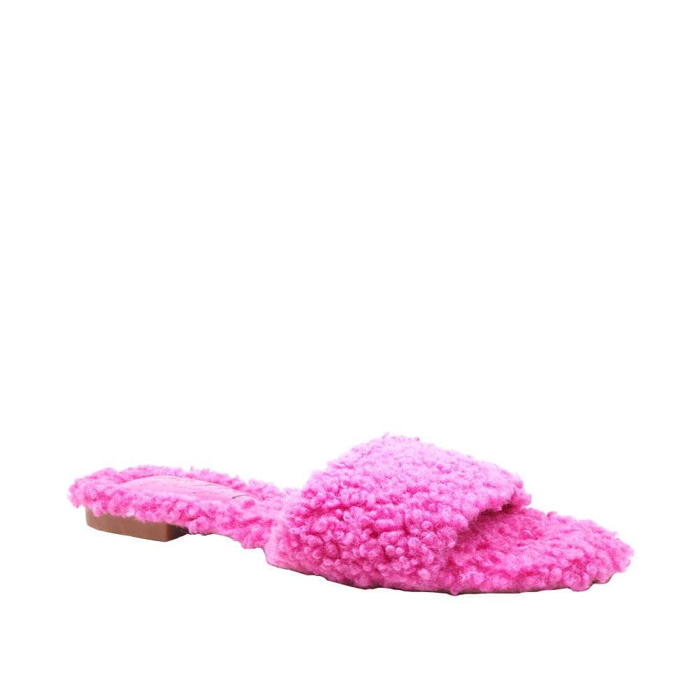 Women's fuchsia colored flats with shearling uppers-corner view