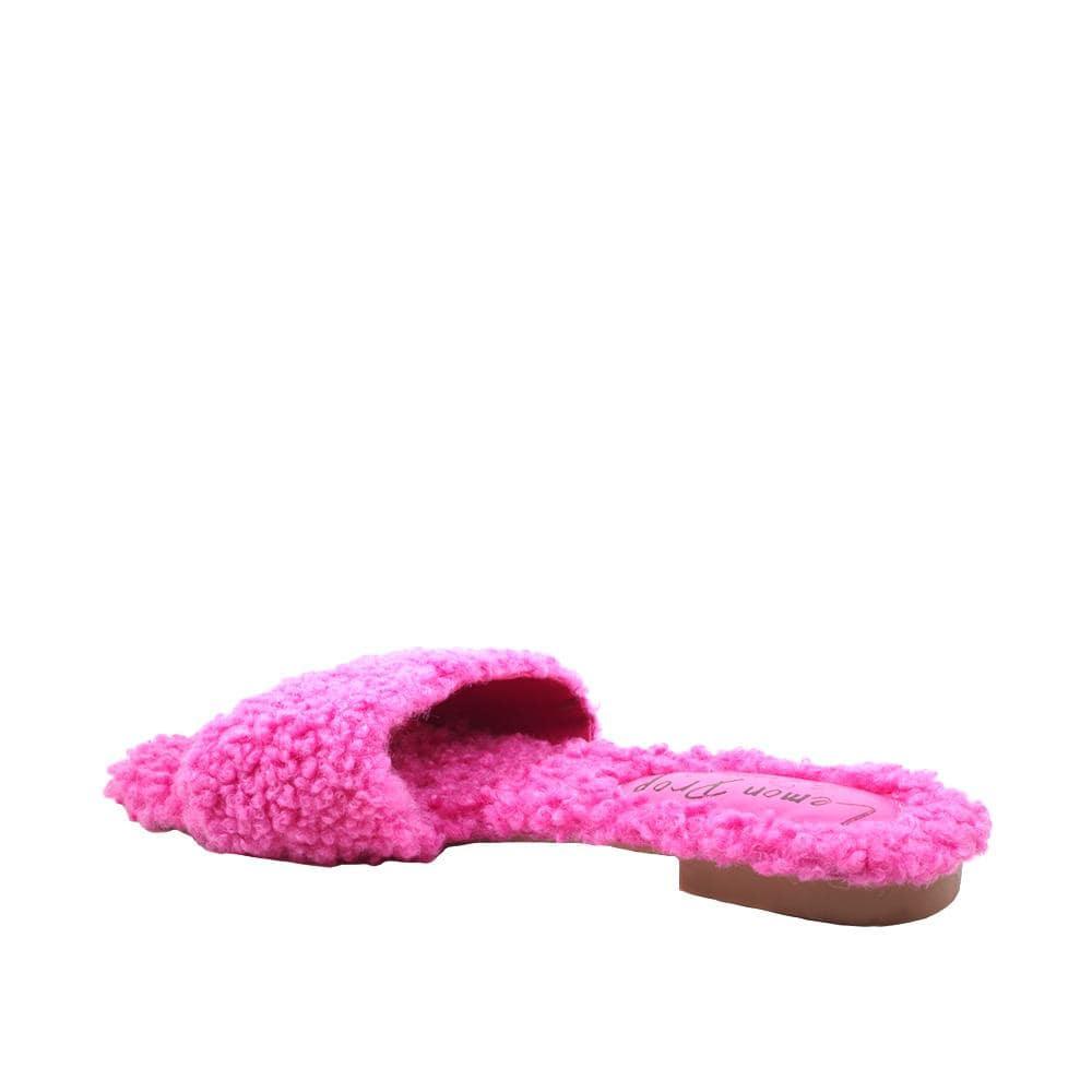 Women's fuchsia colored flats with shearling uppers-posterior view