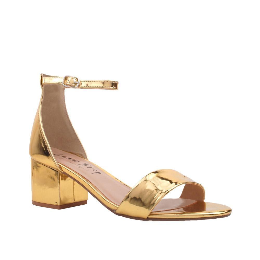 Metallic golden-colored flat heels with ankle buckle strap and open toe-corner view