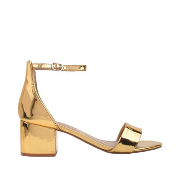 Metallic golden-colored flat heels with ankle buckle strap and open toe-side view