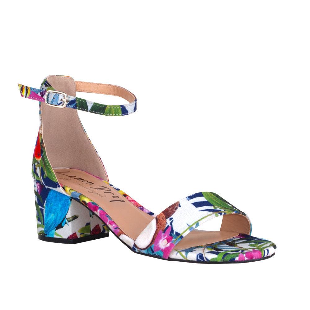 Floral-patterned heel flats with an ankle buckle strap and strap-corner view