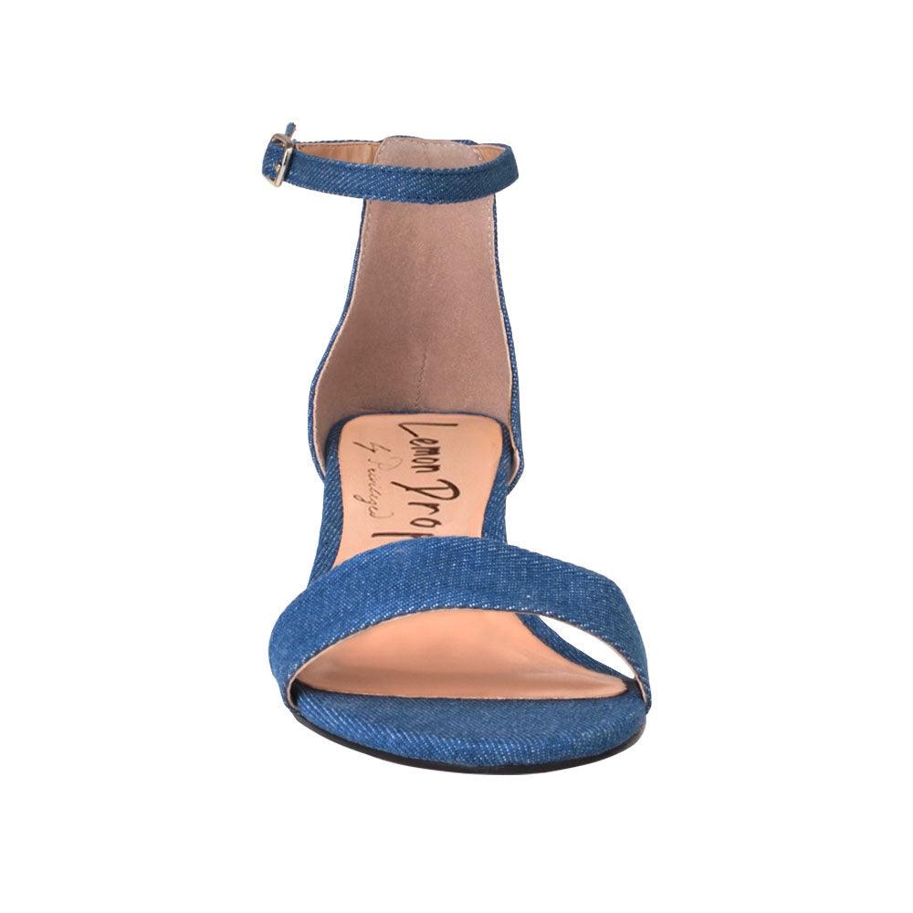 Heel flats in denim-color with a buckle ankle closure and a strapped open toe-front view