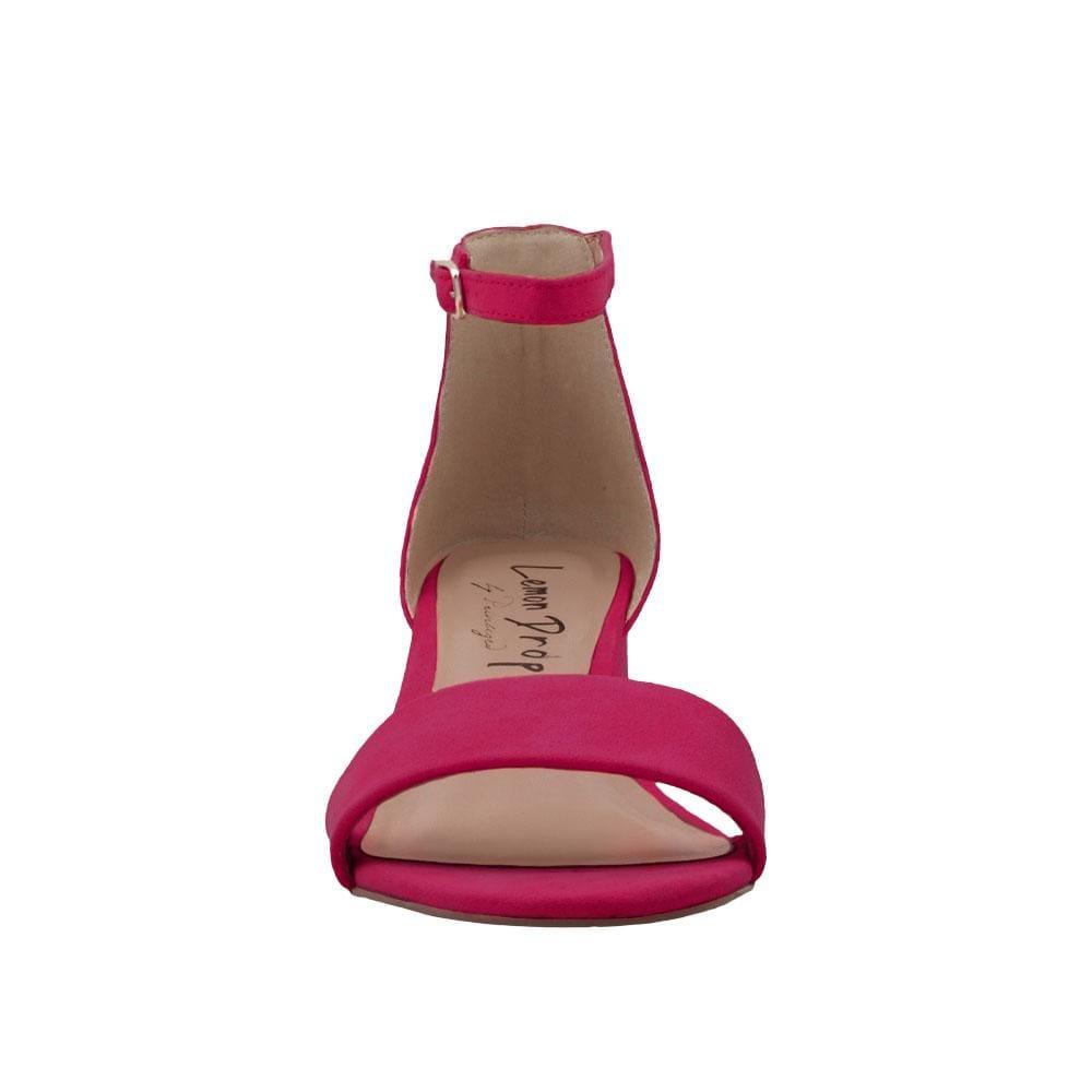 Fuchsia-colored heel flats with a buckle ankle closure and a strapped open toe-front view